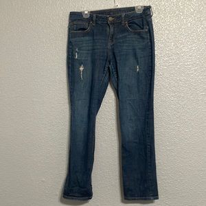 Women’s Jennifer Lopez dark, distressed jeans. Mid rise fit and stretchy